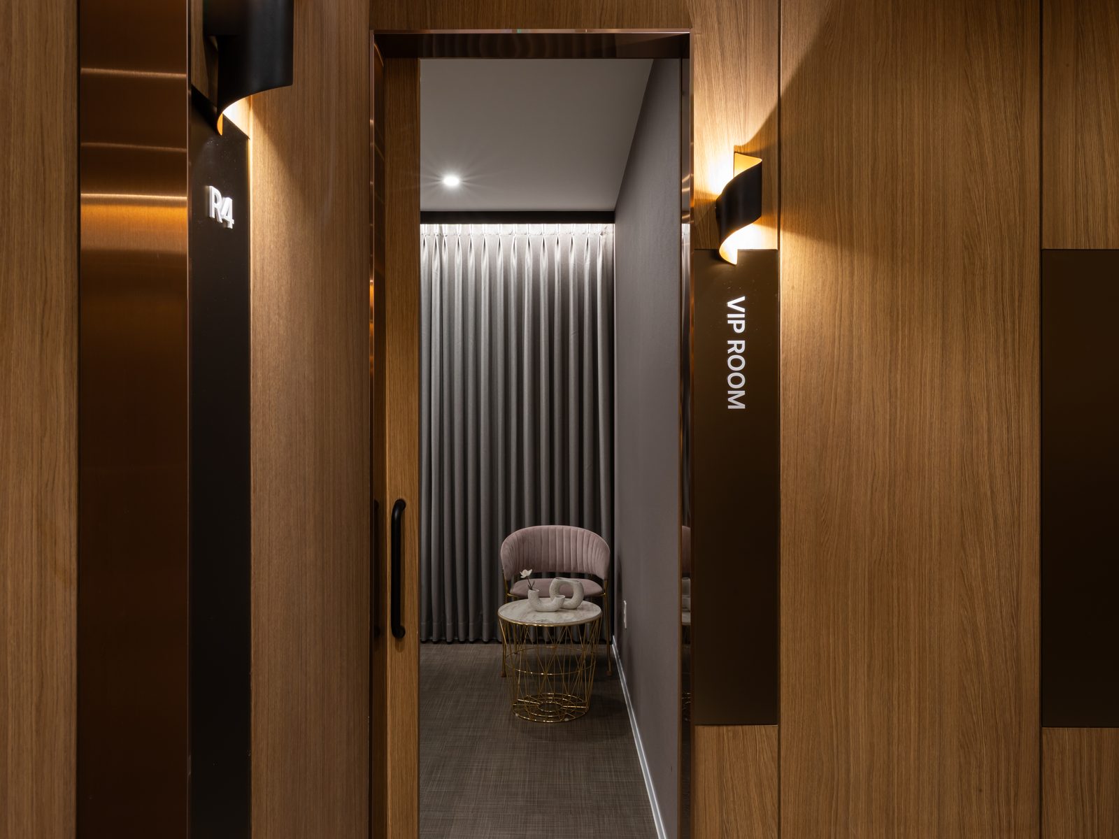 A private care room — one patient, one room, curtained and closed